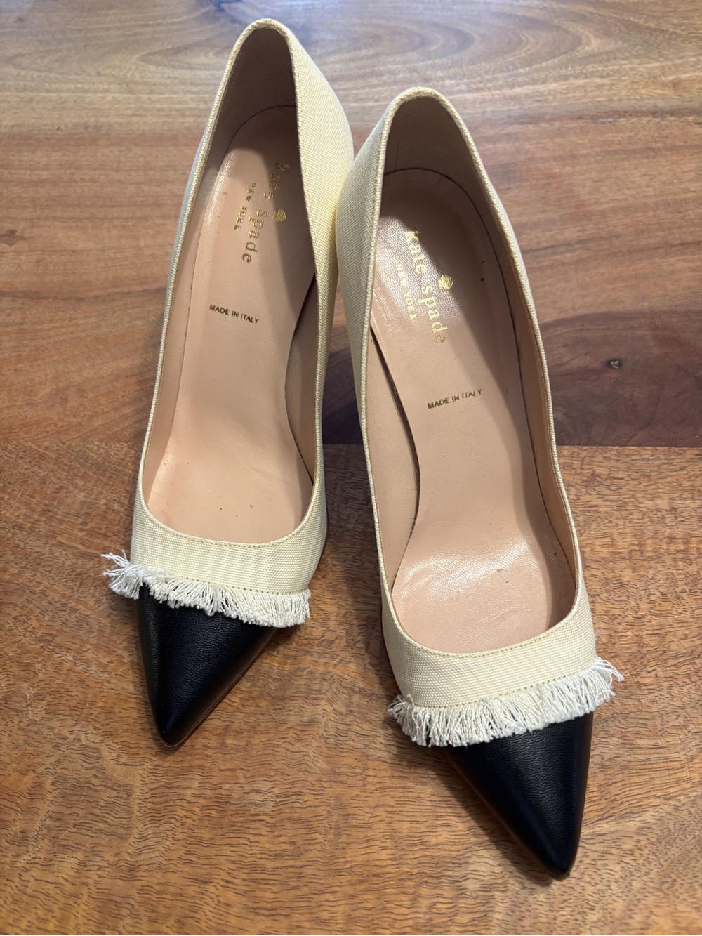 kate spade Cream and Black Pointed Toe Pumps with Fringe Trim